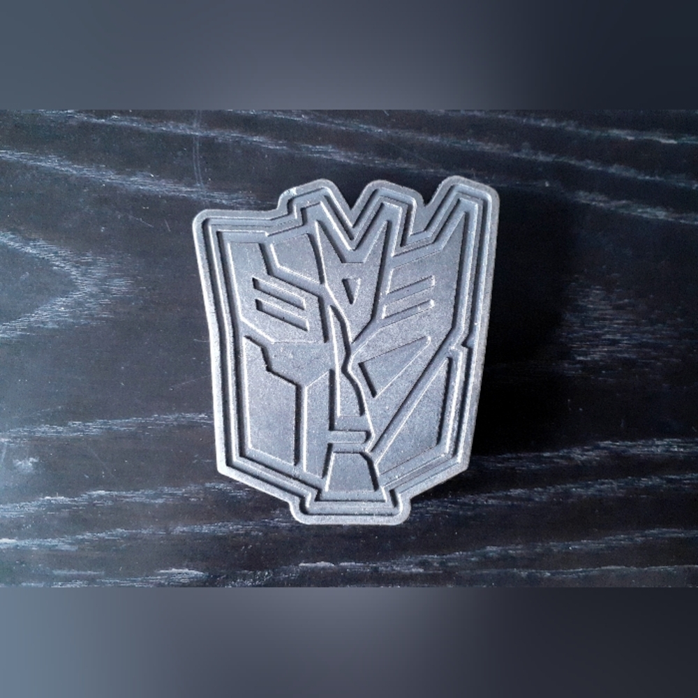 Transformers belt buckle